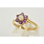 A 9CT GOLD OPAL AND AMETHYST CLUSTER RING, designed with a central opal cabochon, within a