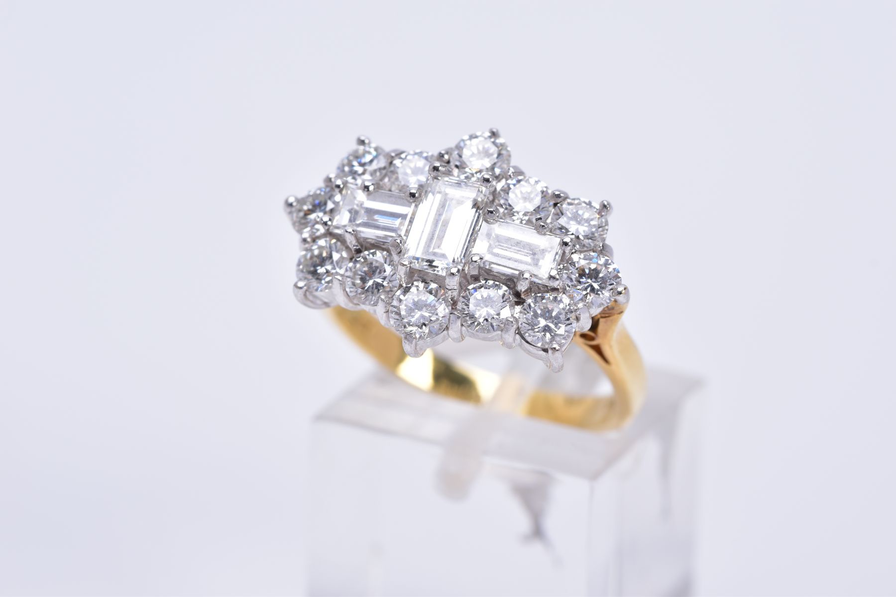 A MODERN 18CT GOLD LARGE DIAMOND CLUSTER RING, comprised three rap cut diamonds, measuring