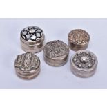 A COLLECTION OF FIVE ASSORTED WHITE METAL SMALL ROUND PILL BOXES, various designs to include