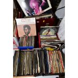 A COLLECTION OF EP'S AND 7'' SINGLES IN FOUR SINGLES BOXES containing over two hundred including