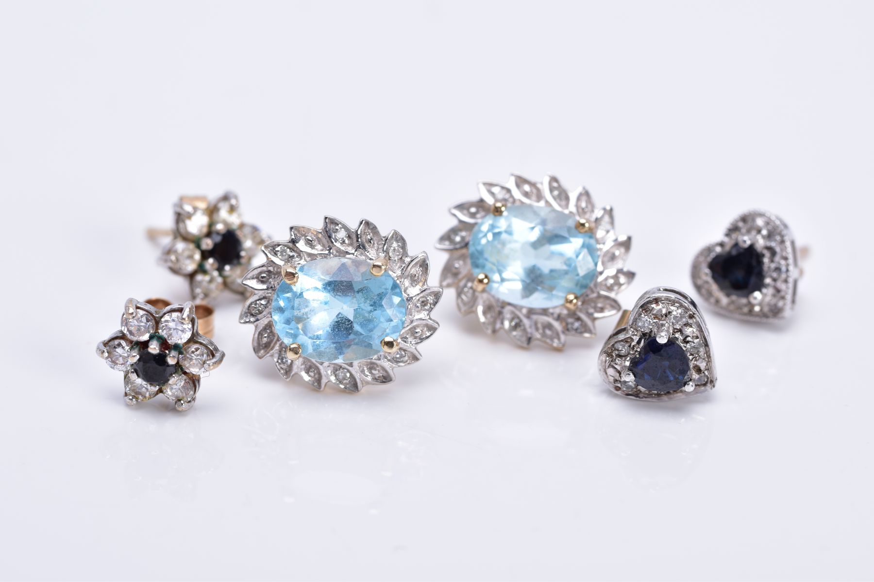 THREE PAIRS OF GEM SET EARRINGS, to include a pair of sapphire and diamond cluster earrings,