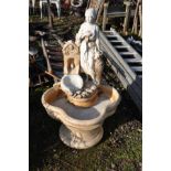 A MODERN COMPOSITE 3 PIECE GARDEN WATER FEATURE in the form of a Lady water carrier by a Well