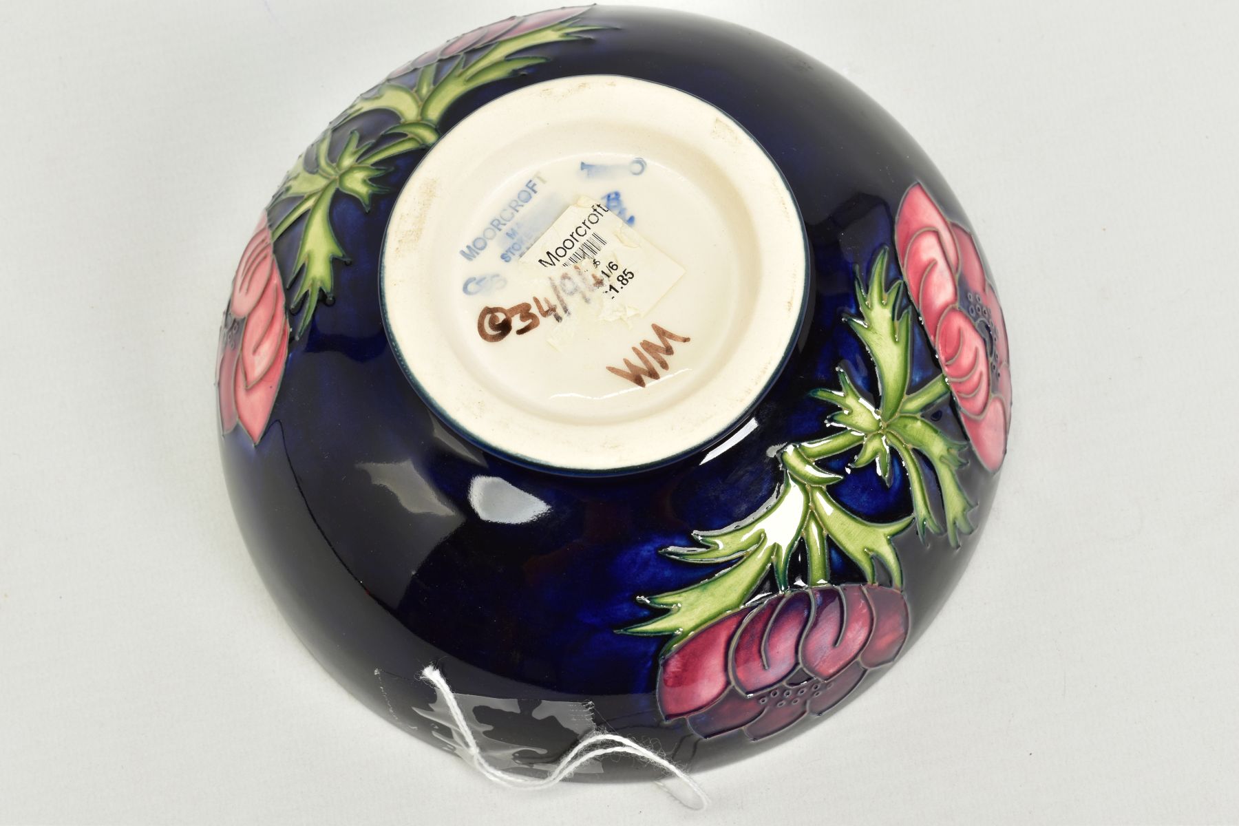 A MOORCROFT POTTERY FOOTED BOWL, 'Anemone' pattern on dark blue ground, impressed backstamp, No 34/ - Image 3 of 3