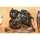 A JAPANESE BRONZE FIGURE GROUP depicting two Tigers attacking an Elephant, script mark to