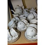 A QUEENS GOLDEN JUBILEE 1952-2002 TEA SET, comprising fifteen cups and sixteen saucers, two milk