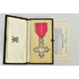 AN MBE MEDAL WITH CASE AND INSTRUCTIONS TO WEAR