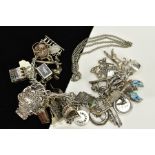 A SILVER CHARM BRACELET, the double link bracelet, suspending thirty-three charms such as a pair