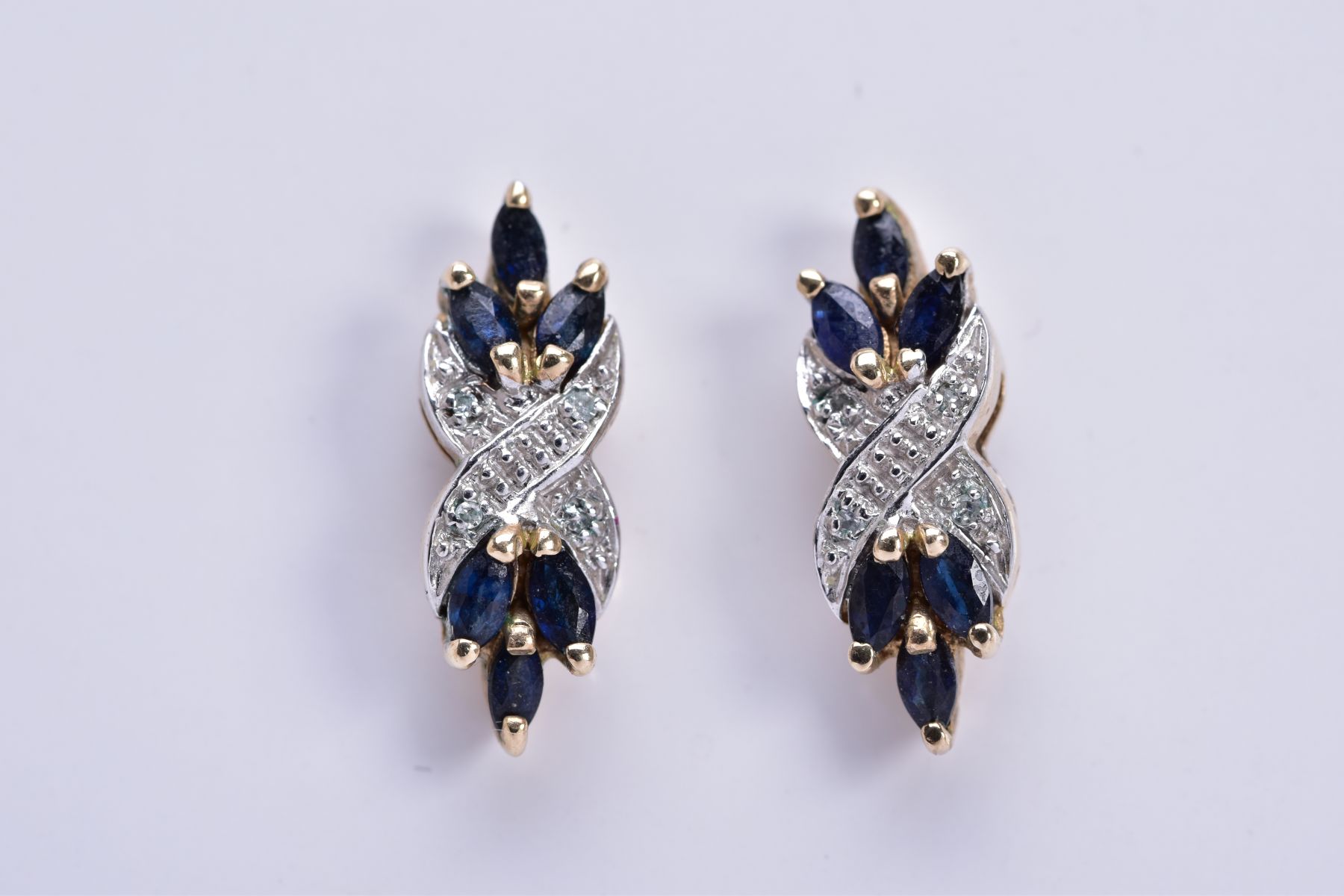 A PAIR OF 9CT GOLD SAPPHIRE AND DIAMOND DROP EARRINGS, each designed with a central cross design set