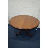 A VICTORIAN MAHOGANY CIRCULAR TILT TOP BREAKFAST TABLE on a bulbous support with tripod scrolled