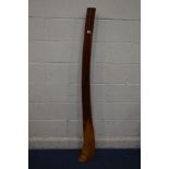 A DECORATIVE HARDWOOD LOUNGE ITEM in the style of a didgeridoo, height 163cm