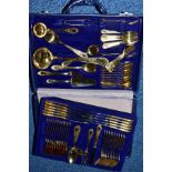 A BESTECKE SOLINGEN CANTEEN OF GILT CUTLERY FOR TWELVE PLACE SETTINGS, two tiers in a briefcase,