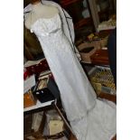 A SOTTERO AND MIDGLEYS WEDDING DRESS, strapless, satin with overlay of fine netting having beading