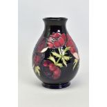 A MOORCROFT POTTERY VASE, 'Anemone' pattern on dark blue ground, impressed backstamp, No 34/94