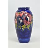 A MOORCROFT POTTERY BALUSTER VASE, 'Anemone' pattern on blue ground, impressed backstamp and Queen