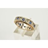 A 9CT WHITE GOLD SAPPHIRE ETERNITY RING, the central white gold panel set with square cut