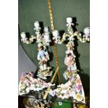 A PAIR OF LATE 19TH CENTURY PLAUE PORCELAIN FIGURAL CANDELABRA, florally encrusted decoration,