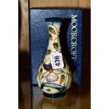 A BOXED MOORCROFT POTTERY COLLECTORS CLUB BUD VASE, 'Sweet Thief' pattern, impressed backstamp,