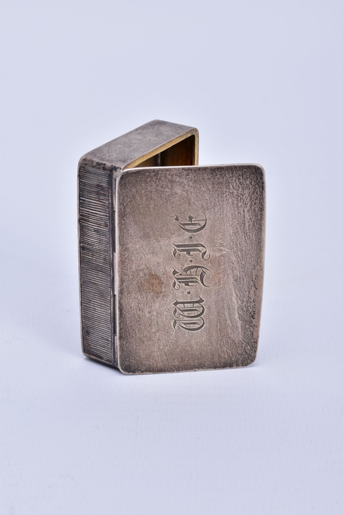 A VICTORIAN SILVER SNUFF BOX, measuring approximately 50mm x 32mm, a plain case with engraved