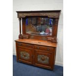 AN EARLY 20TH CENTURY WALNUT ARTS AND CRAFTS MIRROR BACK SIDEBOARD, the top with a bevelled edge