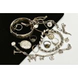 A SELECTION OF JEWELLERY, to include a silver wide hinged bangle, engraved floral design to the