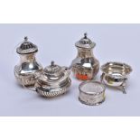 FOUR LATE 19TH AND 20TH CENTURY SILVER CRUET ITEMS AND A SILVER NAPKIN RING, comprising a pair of