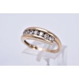 A MODERN DIAMOND HALF ETERNITY RING, cross over design, estimated modern round brilliant cut