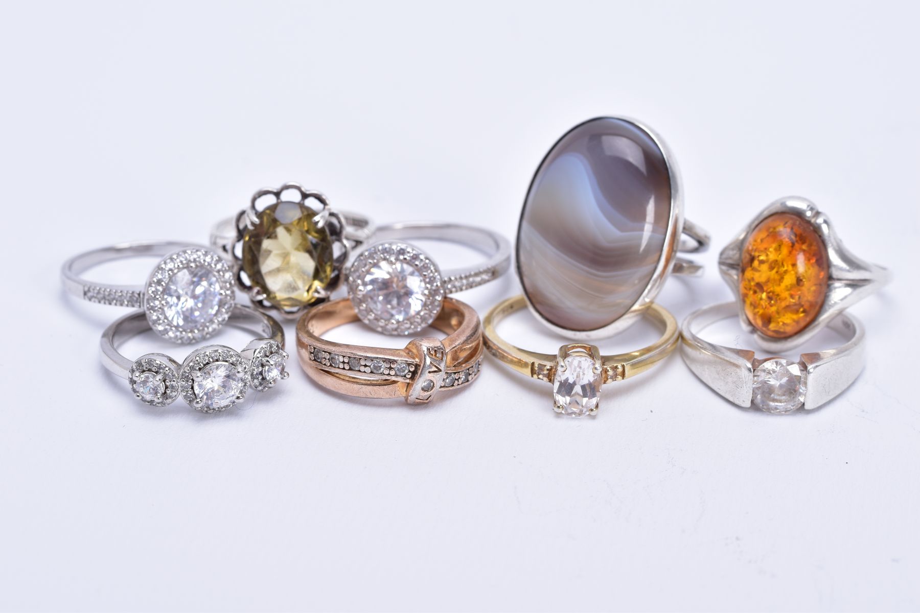 AN ASSORTMENT OF GEM SET RINGS, to include nine rings such as a silver oval agate ring, hallmarked