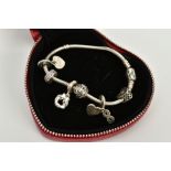 A SILVER PANDORA CHARM BRACELET, the snake chain bracelet with heart clasp signed 'Pandora'