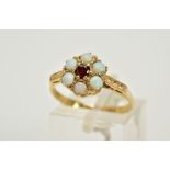 A 9CT GOLD OPAL AND GARNET CLUSTER RING, deigned with a central circular cut garnet, circular cut