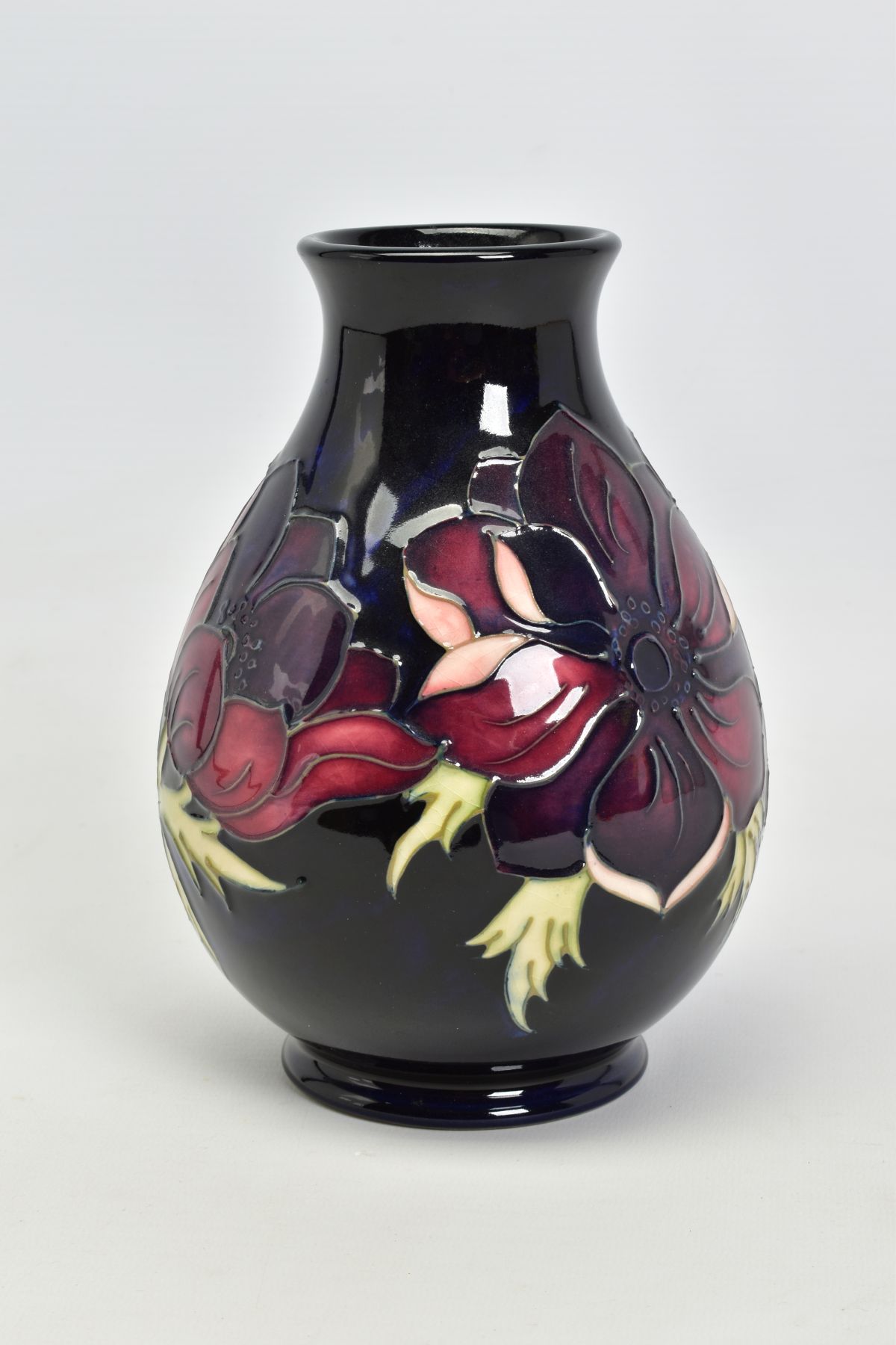 A MOORCROFT POTTERY VASE, 'Anemone' pattern on dark blue ground, impressed backstamp, No 34/94 - Image 2 of 4