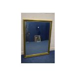 A LARGE MODERN GILT FRAMED BEVELLED EDGE WALL MIRROR, 101cm x 131cm