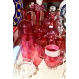 A COLLECTION OF VICTORIAN CRANBERRY AND CLEAR GLASSWARE, including six cream jugs, five small
