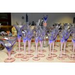 A GROUP OF STUDIO GLASS, WINE GLASSES, ETC, having pink stems and foot, holding blue bowls,