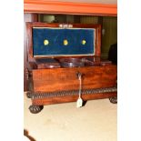 A EARLY VICTORIAN ROSEWOOD SARCOPHAGUS TEA CADDY, reeded rims, turned and lobed wooden side