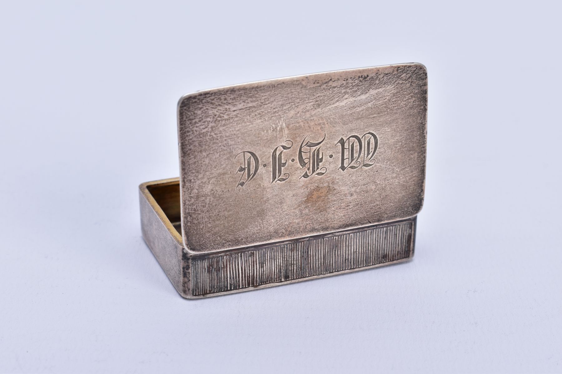 A VICTORIAN SILVER SNUFF BOX, measuring approximately 50mm x 32mm, a plain case with engraved - Image 2 of 3