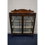 AN EARLY 20TH CENTURY MAHOGANY TWO ASTRAGAL GLAZED DOOR CHINA CABINET with a shaped raised back,