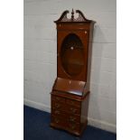 A SLIM MODERN CHERRYWOOD BUREAU BOOKCASE, swan neck pediment above an oval glazed single door, width