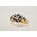 AN EARLY TWENTIETH CENTURY SAPPHIRE AND DIAMOND RING, designed as a lozenge shaped cluster set