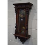 A LATE 19TH /EARLY 20TH CENTURY WALNUT VIENNA WALL CLOCK, the brass dial with Arabic numerals,