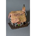 AN ALBANY BONE CHINA AND BRONZE 'WORCESTERSHIRE COTTAGE', modelled by Caroline Parker, stamped to