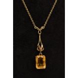 A 9CT GOLD CTIRINE PENDANT NECKLACE, designed with an open work pendant suspending a claw set,