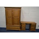 A PINE DOUBLE DOOR WARDROBE, flanked with barley twist rope detail, above a single long drawer,