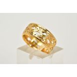 A MID 20TH CENTURY 22CT GOLD ORNATE PIERCED BAND RING, flat section measuring approximately 7.5mm in