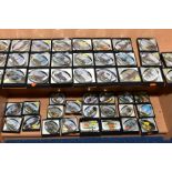 A COLLECTION OF FORTY SEVEN BOXED OVAL GLASS PAPERWEIGHTS, each with a print to the base, mostly