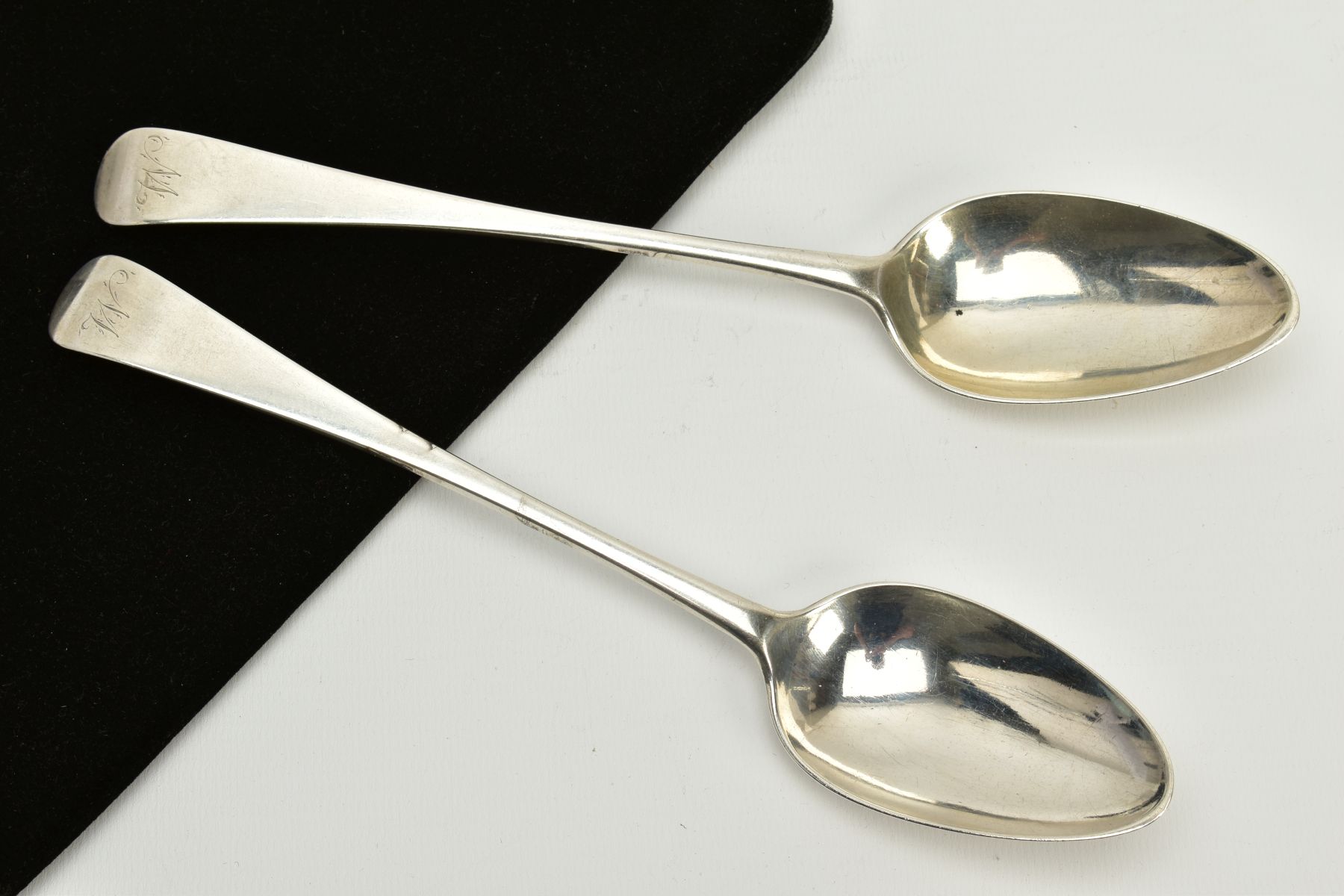 A PAIR OF PROVINCIAL SCOTTISH SILVER TABLESPOONS, plain polished spoons with engraved initials to