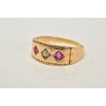 A LATE VICTORIAN RUBY AND DIAMOND THREE STONE RING, an old mine cut diamond estimated weight 0.10ct,