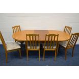 A 1980'S TEAK OVAL TOPPED EXTENDING DINING TABLE, one additional fold out leaf, extended length