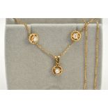 AN 18CT GOLD DIAMOND PENDANT NECKLACE AND EARRING SET, the pendant set with a single round brilliant