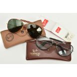 TWO PAIRS OF RAY-BAN OUTDOORSMAN SUNGLASSES, the first with black tinted glass, brown leather frame,