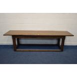 A 17TH CENTURY AND LATER OAK SERVING TABLE, double plank top, carved lunettes to frieze, on a